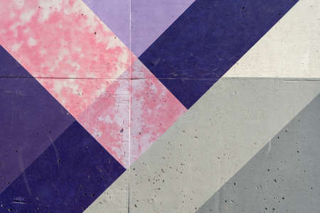 Old wall painted with lackluster colors that is chipped or peeling due to the passage of time and no maintenance.の写真素材