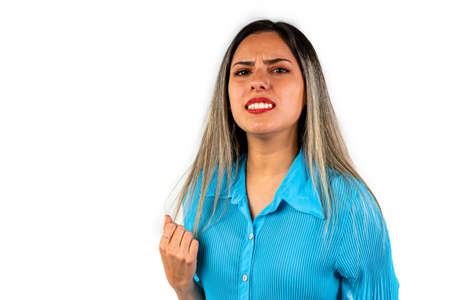 A Beautiful young woman with frustration expression background.の写真素材