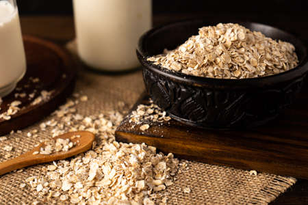 A Close-up of a bowl with oatmeal on a kitchen table. Chopped sight.