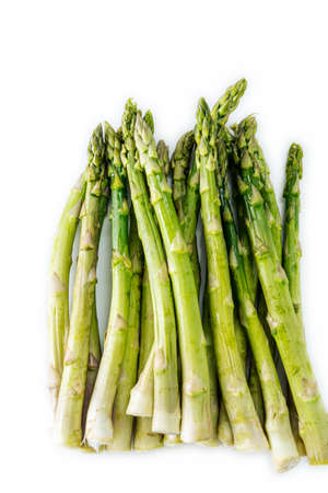 A Group of raw green asparagus isolated on white background.の写真素材