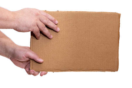 Two Hand holding a cardboard sign without any legend from the side.の写真素材