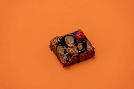 Chocolate brownie squares with walnut pieces, chocolate threads and granola. Natural, healthy food concept. High view. Copyspace.の写真素材