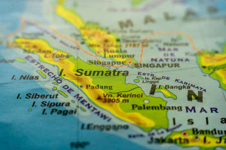 Close-up of the orographic map of Sumatra island of Indonesia in the Pacific Ocean south of the Indonesian Peninsula with references in Spanish. Concept cartography, Travel, tourism, geography. Differential focus.の写真素材