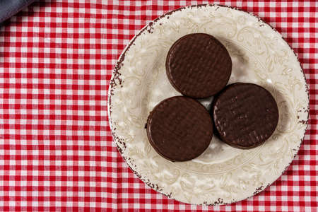 Top view of some classic argentinian chocolate alfajores filled with dulce de leche. Traditional food. Copy text.の写真素材