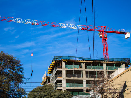Construction crane at the construction site of a large building.