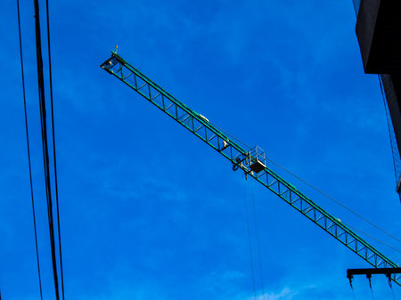 Construction crane at the construction site of a large building.