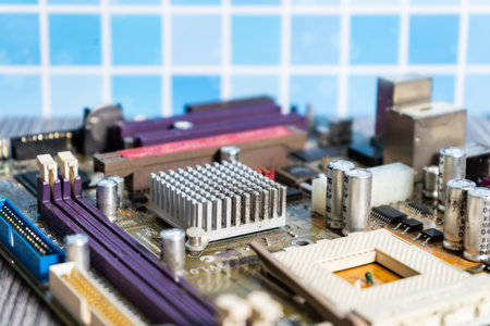A PC motherboard on a wooden table.