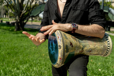 Hands of a percussionist playing his derbake or darbuka of Arabic originの写真素材