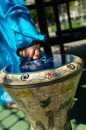 A foot of an odalisque playing with a darbuka or derbakeの写真素材
