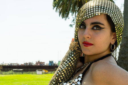 A portrait of a young brown-eyed dancing woman