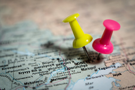 Two pushpins marking locations on map of ukraine, showing zaporizhzhia and taganrog