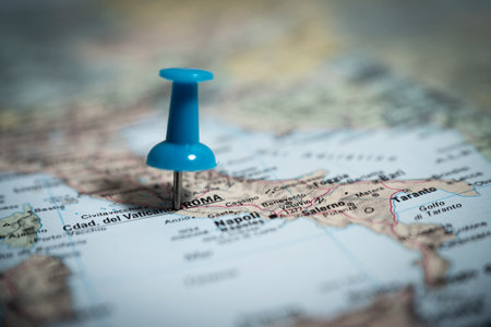 Blue push pin marking rome on map of italy, travel destination planningの写真素材