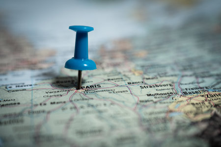 Blue push pin marking paris on map of france, travel destination planningの写真素材