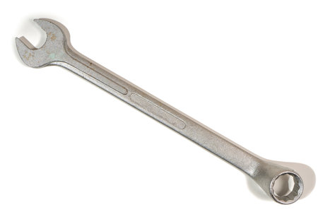Chrome wrench lying diagonally on a white background, ideal for construction and repair conceptsの写真素材