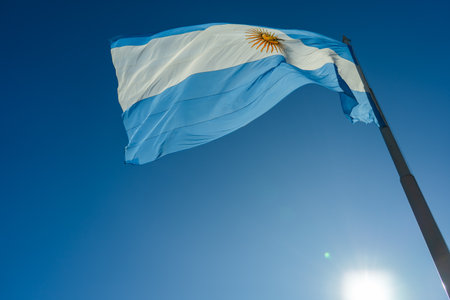 Argentinian flag waving on a sunny day with clear blue sky
