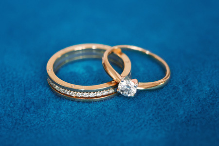 Two beautiful wedding rings with brilliants close upの写真素材