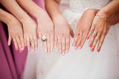 The bride and bridesmaids are showing their hands with rings. Marriage conceptの写真素材