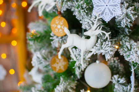 Green decorative christmas tree with figure of deer, close-upの写真素材