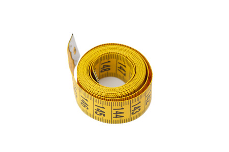 Measuring tape of the tailor isolated on white background, closeupの写真素材