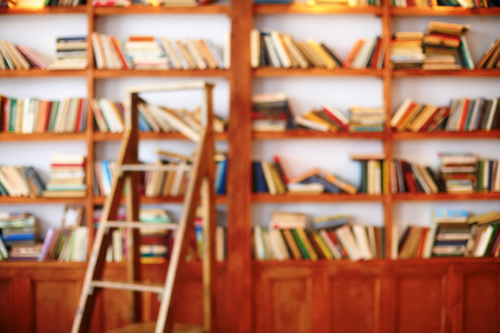 Books on bookshelf. Library room, abstract defocused blurred backgroundの写真素材