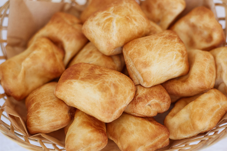 Basket with freshly baked sweet buns, selective focusの写真素材