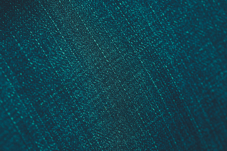 Teal jean denim fabric texture background, vintage toned, closeupの写真素材