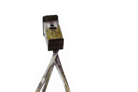 Old vintage wooden roof bird house, nesting box, isolatedの写真素材