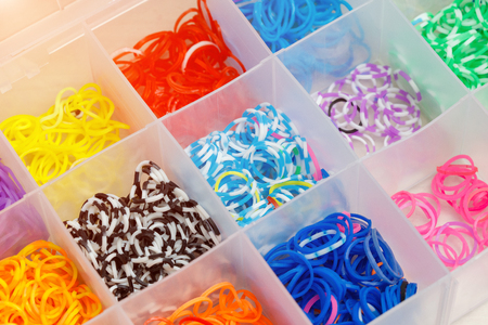 Multicolor rainbow loom rubber bands for weaving in box, closeup