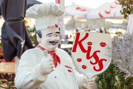PETROVAC, MONTENEGRO - SEPTEMBER 14, 2019: Cheerful Chef statue near street restaurant KISSのeditorial素材