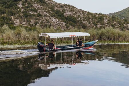 RIJEKA CRNOJEVICA, MONTENEGRO - SEPTEMBER 11, 2019: Touristic passenger boat on excursion to Lake Skadar National Park in Montenegroのeditorial素材