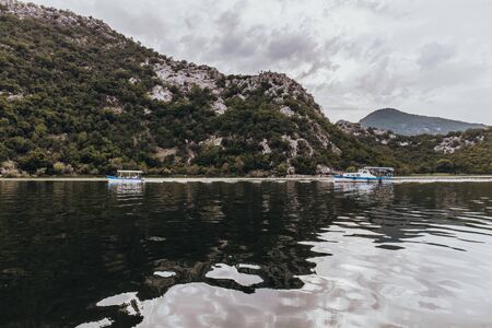 RIJEKA CRNOJEVICA, MONTENEGRO - SEPTEMBER 11, 2019: Touristic passenger boat on excursion to Lake Skadar National Park in Montenegroのeditorial素材