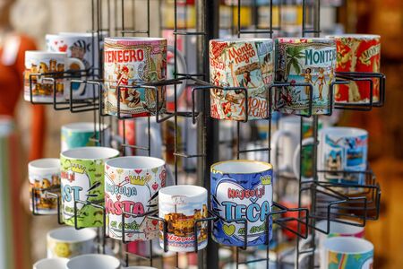 PETROVAC, MONTENEGRO - SEPTEMBER 18, 2019: Stand with souvenir mugs in street marketのeditorial素材