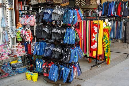 Petrovac, montenegro - september 18, 2019: Colorful shoes, sandles and flip flops in street marketのeditorial素材