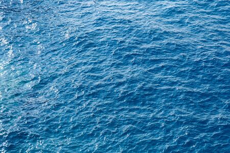 Blue sea surface background with waves aerial view