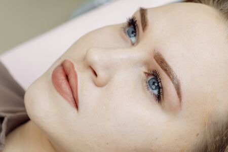 Result of permanent makeup, tattooing of eyebrows in beauty salonの写真素材
