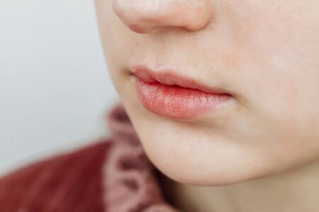 Lips after permanent makeup in beauty salon, macro viewの写真素材
