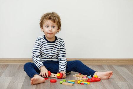 Child boy sitting and playing. Stay home concept, Coronavirus Covid-19 quarantineの写真素材