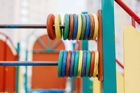 Children's playground with clolorful wooden rings game, closeupの写真素材