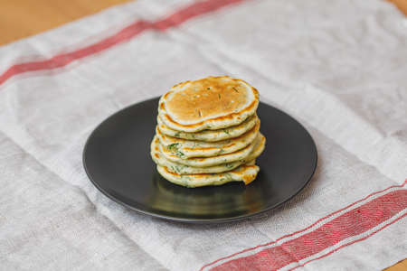 Plate with stack of fresh fried pancakes on table, closeupの写真素材