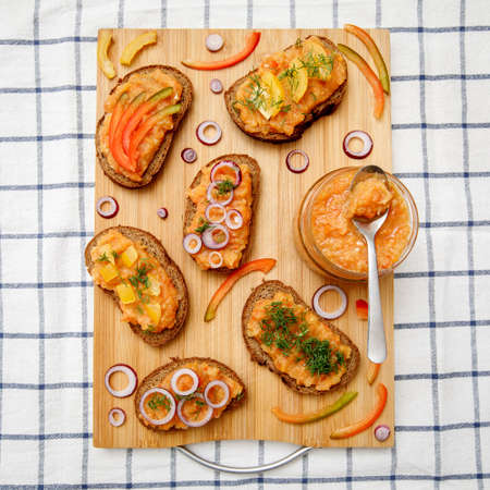 Bread with homemade vegetable caviar made of zucchini, onion, carrot, bell peppers and eggplantの写真素材