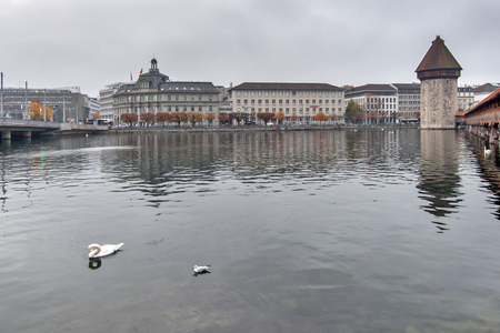 LUCERNE, SWITZERLAND - OCTOBER 28, 2015: foggy morning and Chapel Bridge over Reuss River, Lucerne, Switzerlandのeditorial素材