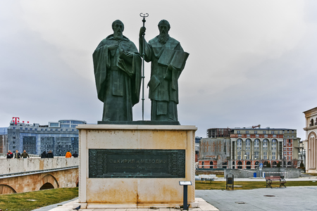 SKOPJE, REPUBLIC OF MACEDONIA - FEBRUARY 24, 2018:  Monument of St. Cyril and Methodius and Old Stone bridge, Republic of Macedoniaのeditorial素材