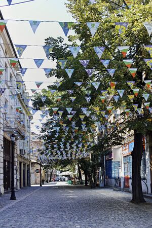 PLOVDIV, BULGARIA - JULY 5, 2018:  Street and houses in district Kapana, city of Plovdiv, Bulgaria