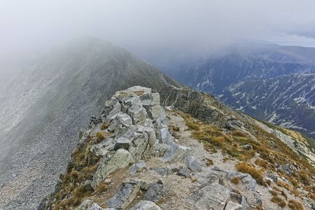 Amazing Panoramic view of hills covered with fog from Musala peak, Rila mountain, Bulgaria