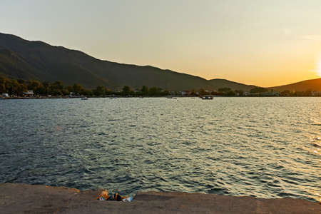 STAVROS, GREECE - AUGUST 19, 2019:  Sunset at coastline of village of Stavros, Chalkidiki, Central...