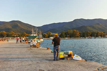 STAVROS, GREECE - AUGUST 19, 2019:  Sunset at coastline of village of Stavros, Chalkidiki, Central Macedonia, Greeceのeditorial素材
