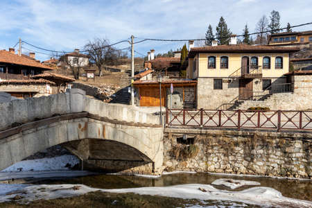 KOPRIVSHTITSA, BULGARIA - JANUARY 25, 2020: Old Stone Bridge over Topolnitsa River in historical town of Koprivshtitsa, Sofia Region, Bulgariaのeditorial素材