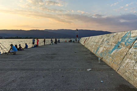 STAVROS, GREECE - AUGUST 19, 2019:  Sunset at coastline of village of Stavros, Chalkidiki, Central Macedonia, Greeceのeditorial素材