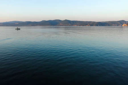 GOLUBAC, SERBIA - AUGUST 11, 2019: Amazing Sunset landscape of costal street and Danube River at town of Golubac, Serbiaのeditorial素材