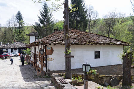 BOZHENTSI, BULGARIA - MAY 3, 2021: Typical street and old houses at historical village of Bozhentsi, Gabrovo region, Bulgariaのeditorial素材